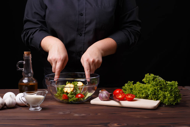 Chef cooking salad. Food preparation process - Valokuva, kuva