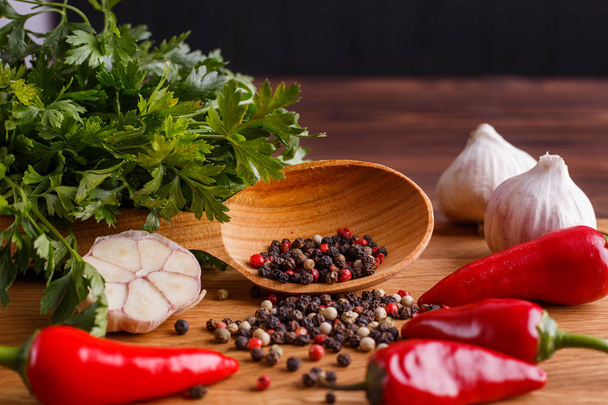 Herbs and spices on rustic wooden table. Kitchen background, coo - 写真・画像