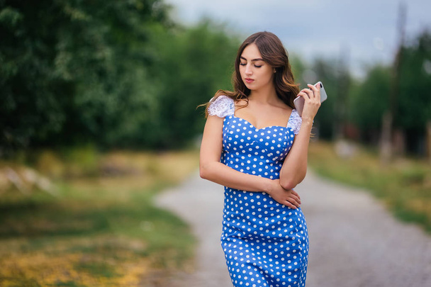 Portrait of woman with smart phone. Cropped image of young prett - Фото, изображение