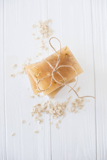 White and beige handmade soap bars with oat flakes - Fotó, kép