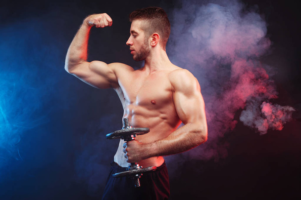 Studio shoot of young ripped man bodybuilder with perfect abs, s - Foto, immagini