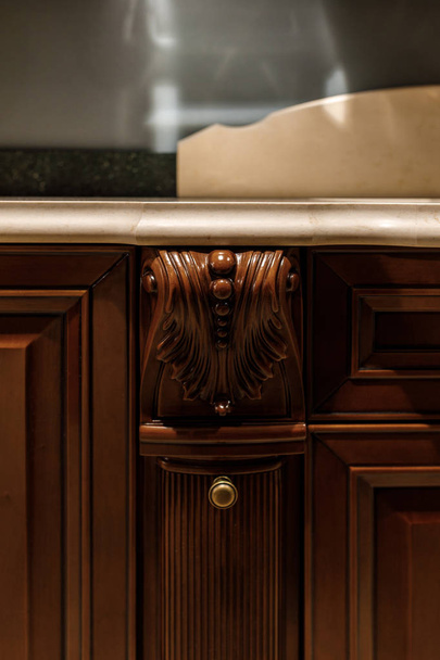 Elegant details of wooden counter in stylish kitchen - Foto, afbeelding