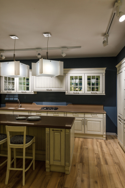 Renovated kitchen interior with lamps over counter - Photo, Image