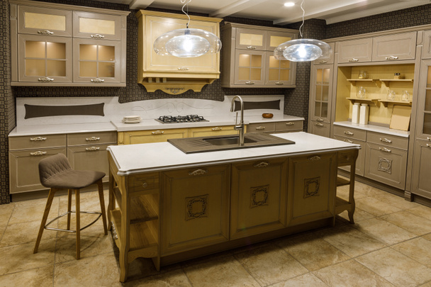 Interior of modern kitchen with beige cabinets - Foto, afbeelding