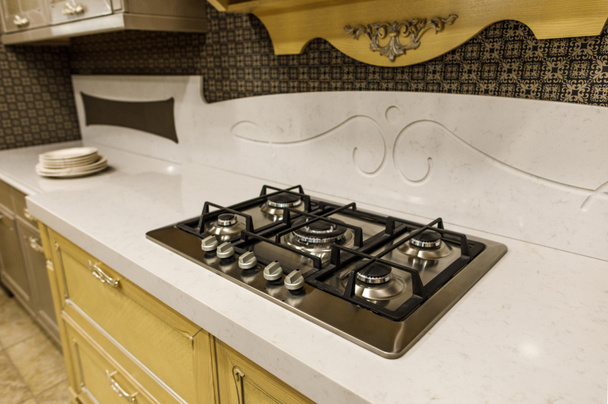 Stylish kitchen with stove on white counter - Foto, Bild