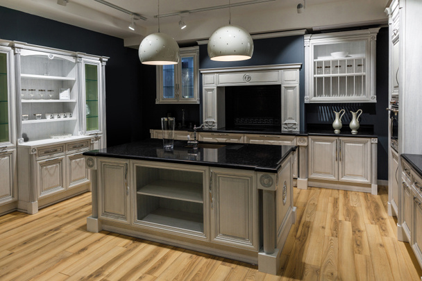 Renovated kitchen interior in dark tones - 写真・画像