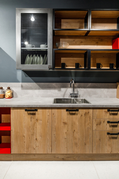 Stylish kitchen with elegant wooden cabinets and stove - Fotografie, Obrázek