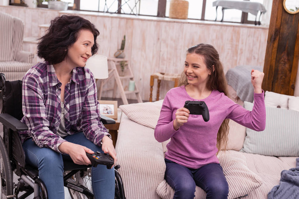 Gay girl challenging incapacitated woman in video games - Photo, Image