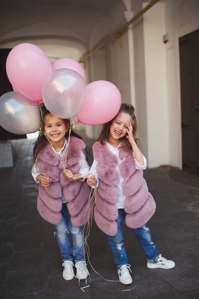 stylish funny little girls on the street - Фото, зображення