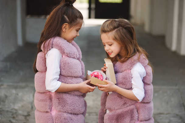 stylish funny little girls on the street - Фото, изображение