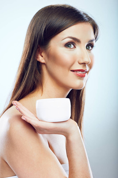 Beauty face portrait of woman holding jar cream.  - Fotó, kép