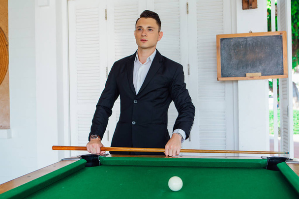 Young handsome man playing billiard game alone - Φωτογραφία, εικόνα