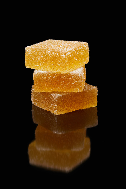 closeup view of stack of jelly candies on black background - Zdjęcie, obraz