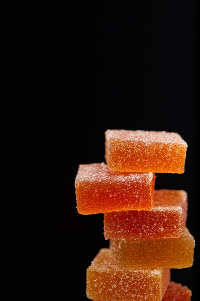closeup view of stack of jelly candies isolated on black background - Photo, Image