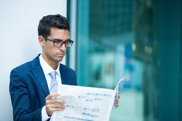 Business man reading the newspaper in front of his modern office - Φωτογραφία, εικόνα