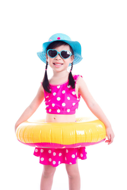 Little girl in swim suit smiling over white  - Foto, Imagen