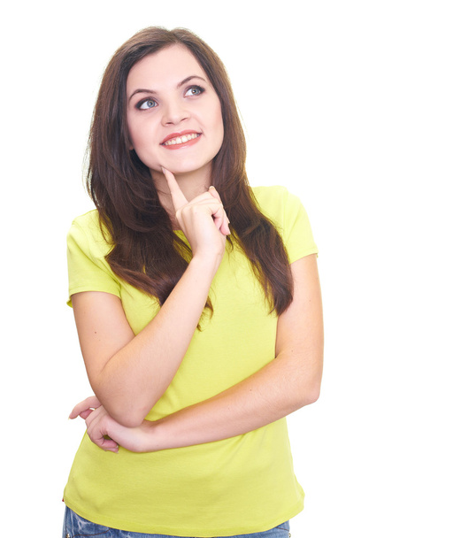 Attractive smiling young woman in a yellow shirt holding her fin - Фото, изображение