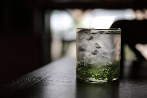 Water in glass in wood background - 写真・画像