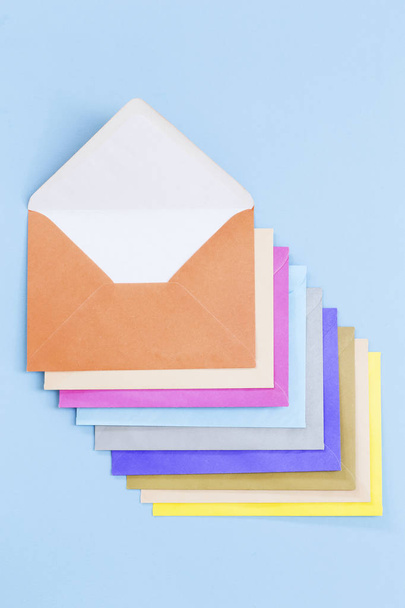 Colorful envelopes on blue - 写真・画像