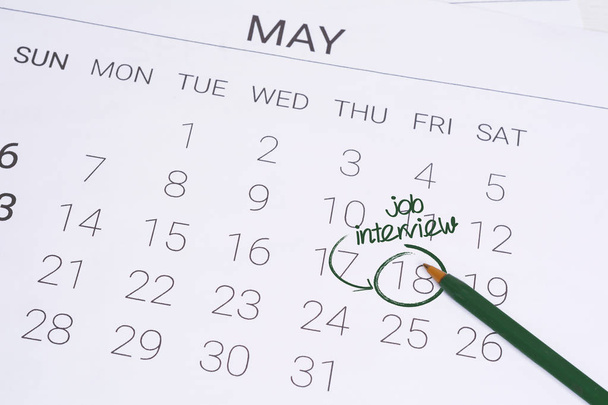 Calendar with date reminder about job interview - Foto, Bild