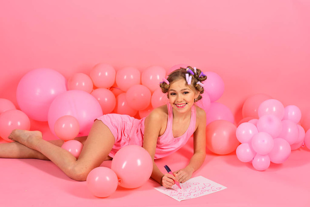 Childhood, happiness, punchy pastels. Party balloons, retro kid in curlers, art. Valentines day card, love, birthday. Little girl paint heart on paper, mothers day. Small girl child painter on pink. - Photo, image