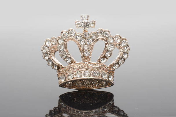 golden brooch crown isolated on black - Photo, Image