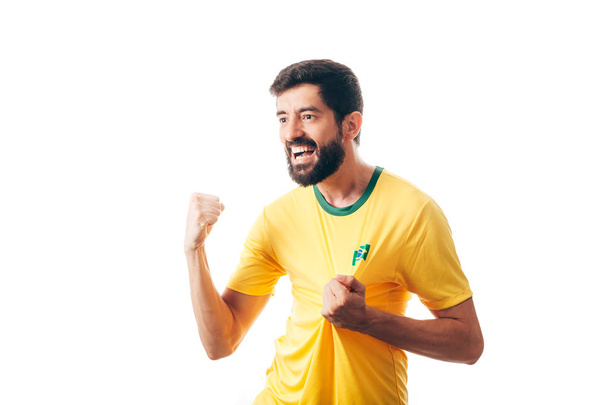 Brazilian soccer player celebrates on white background - 写真・画像