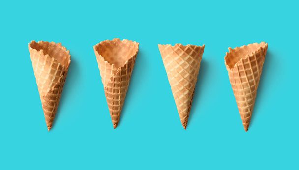 Collection of empty ice cream cones on retro color background - Фото, изображение