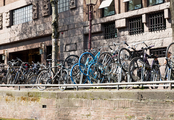 bicycles on the sidewalk in Amsterdam - Photo, Image