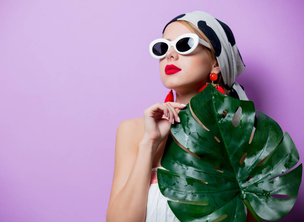 woman in sunglasses with palm leaf - Photo, Image