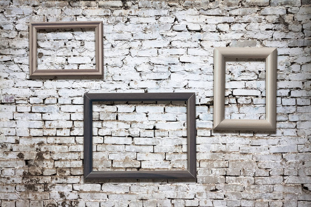 old photo frames on brick wall - Фото, зображення