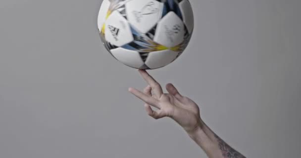 Kyiv, Ukraine - February 22, 2018: male hand spinning and throwing official UEFA Champions League 2018 season ball (Adidas Final Kiev) during UEFA Champions League  - Metraje, vídeo