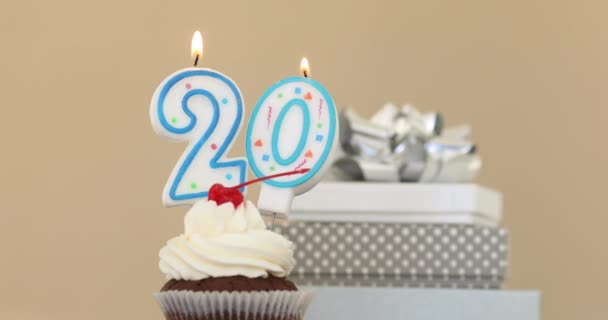 Twenty 20 candle in cupcake pastel background - Footage, Video