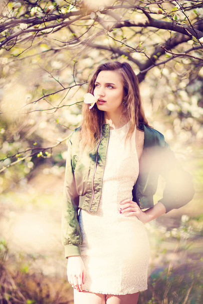 girl posing in magnolia garden - Valokuva, kuva