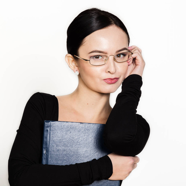 young beautiful Asian businesswoman wearing eyeglasses with folder for papers - Foto, Imagem