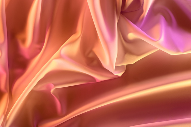 close up view of elegant pink silky fabric as background - Fotoğraf, Görsel