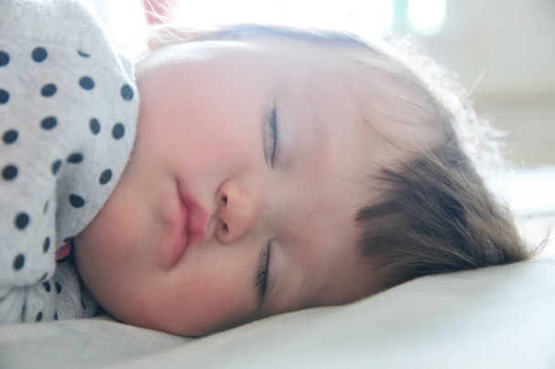 Baby sleeping portrait close up, daytime resting, health care. Little girl sleep cute - Zdjęcie, obraz
