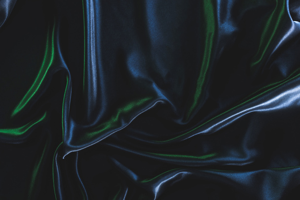 full frame of dark elegant silk fabric as background - Fotó, kép