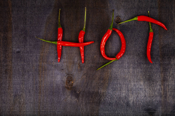 Word "hot" is made from chili peppers. - Photo, Image