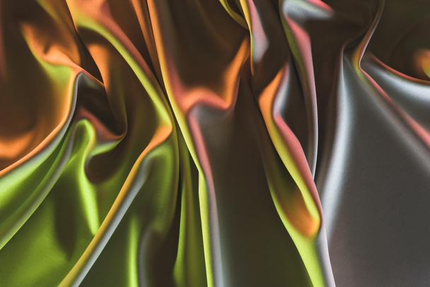 toned picture of elegant folded silk fabric background - Foto, Imagen