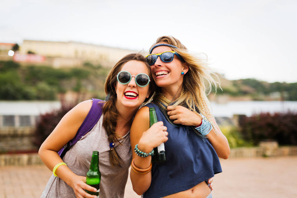 Happy friends laughing and having fun outdoors - Foto, Imagen