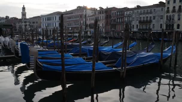 Traditional gondola boats on a canal in Venice - Footage, Video