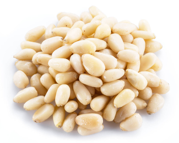 Pine nuts on the white background. Organic food. - Photo, Image