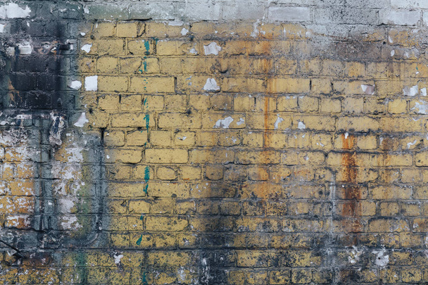 Old weathered rusty yellow brick wall texture background for design - Foto, afbeelding