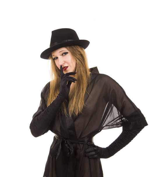 Beautiful young girl in black tunic, black hat and black gloves. - Valokuva, kuva