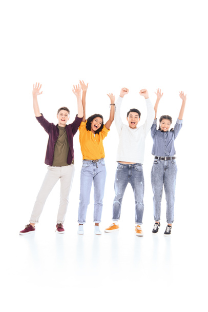 cheerful multicultural teenagers with outstretched arms isolated on white - Valokuva, kuva