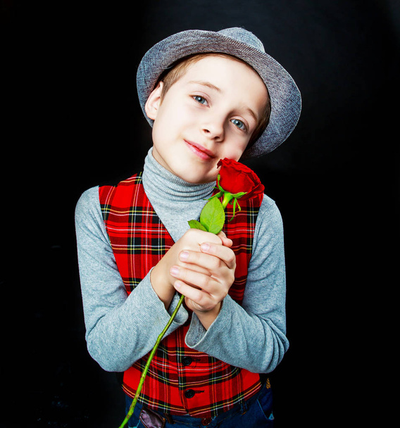 hansome boy  with rose in his hands  - Foto, Bild