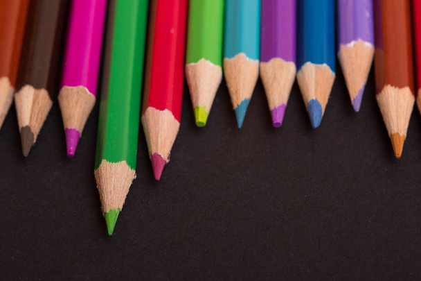 Wooden colorful pencils, on a dark background - Фото, зображення