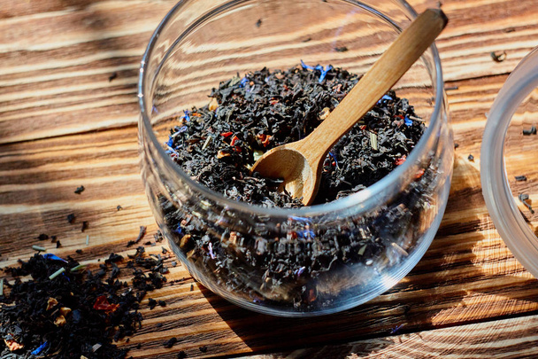 Dry tea in wood spoon - Photo, Image