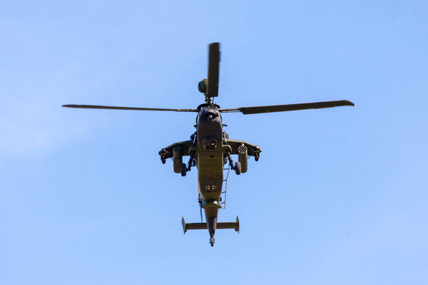BERLIN / GERMANY - APRIL 28, 2018: Military twin-engined attack helicopter Tiger, from Airbus Helicopters flies at airport Berlin / Schoenefeld. - Photo, image